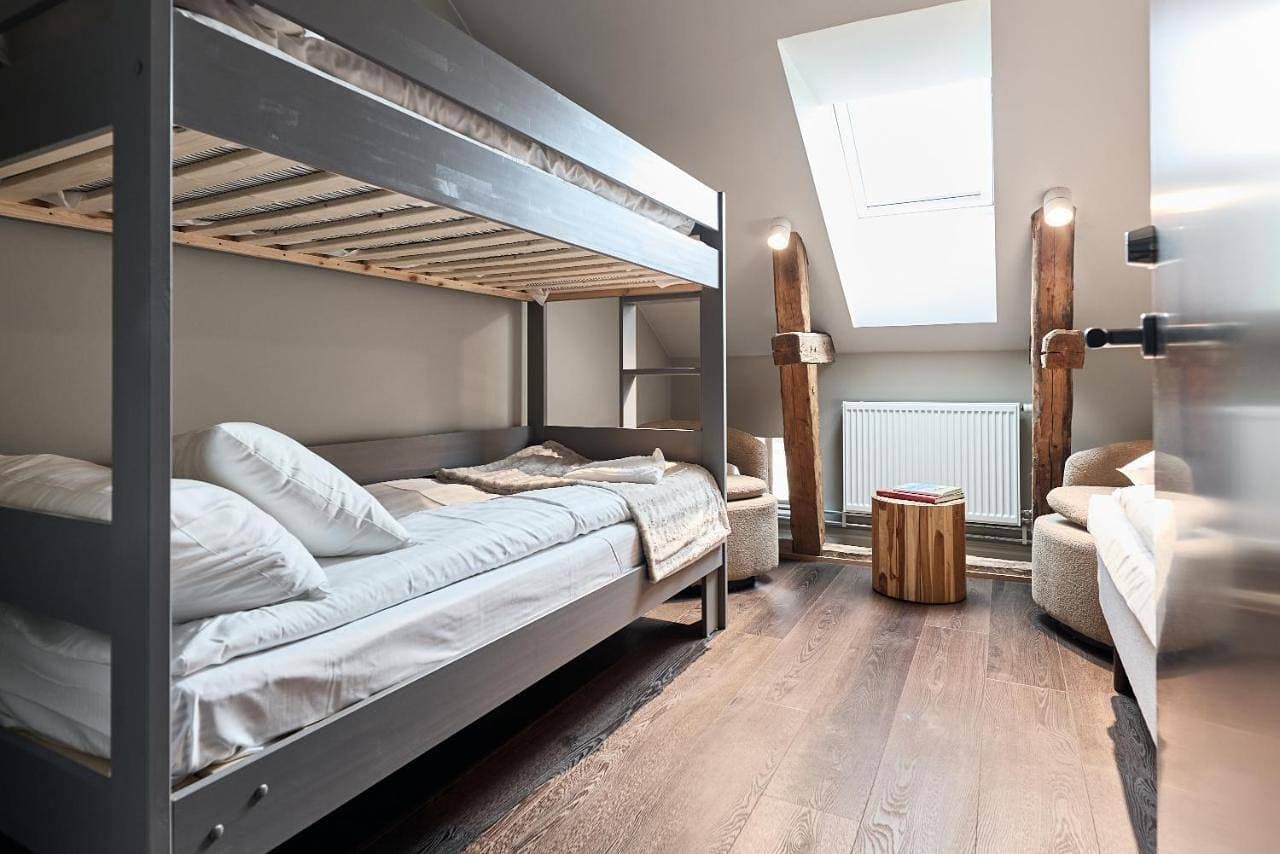 Foto 6 von 12: Triple Room with Shared Bathroom