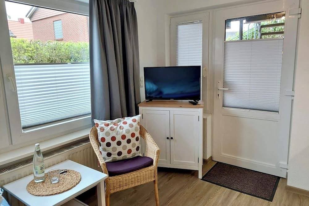 Daubs Inseloase – Apartment 4 mit Terrasse, tierfrei & strandnah 1