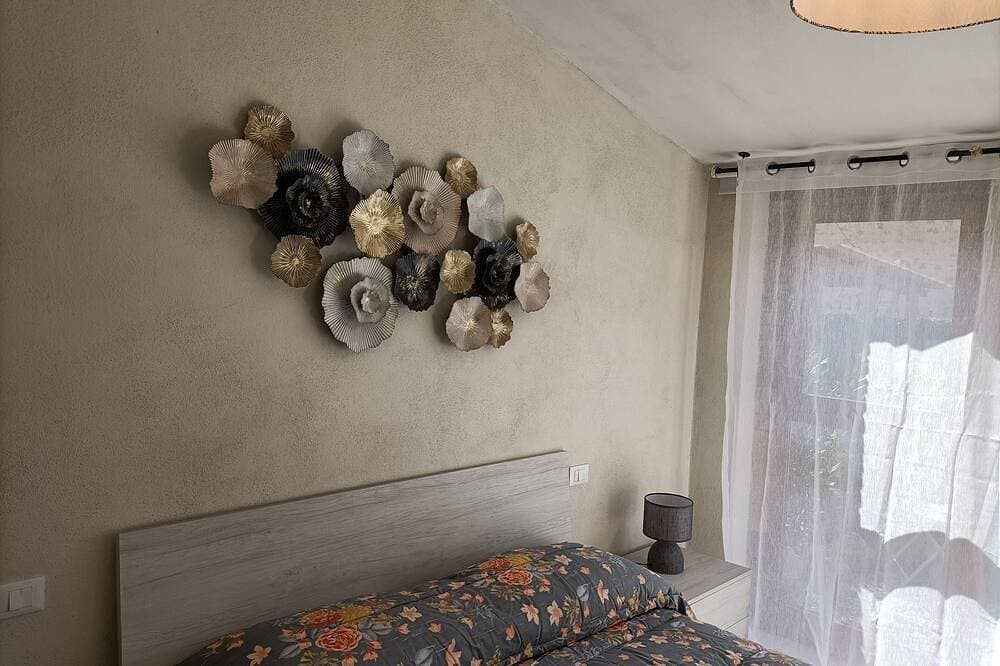 Foto 4 von 12: Il Cedro - double room with garden (no apartment)