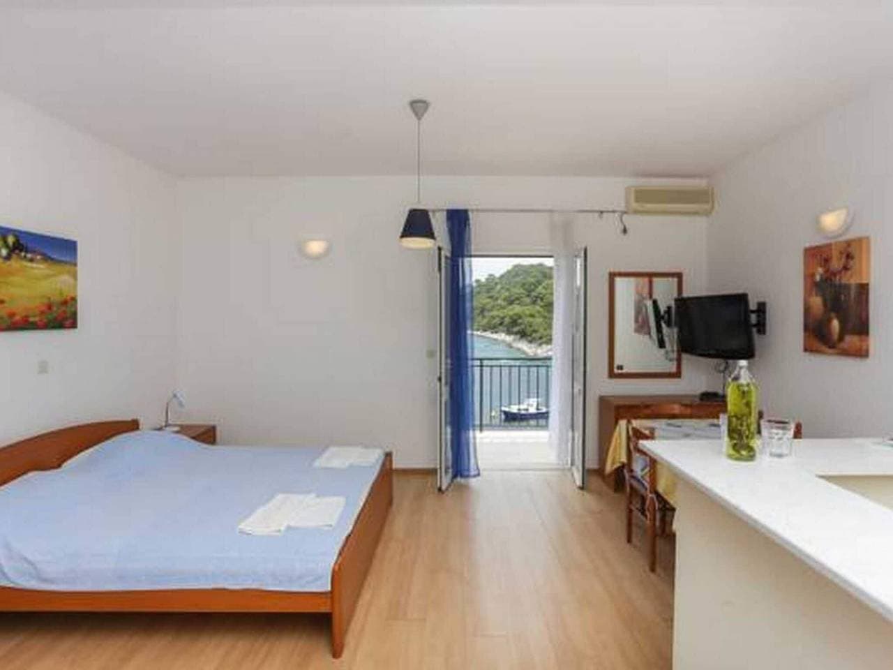 Foto 4 von 10: Apartments Posta - Comfort Studio with Balcony and Sea View - Apartman 1