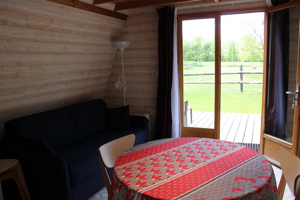 Foto 6 von 15: 2**Lodge Bois Confort 5 minutes from the beach and 10 minutes from Pointe du Hoc