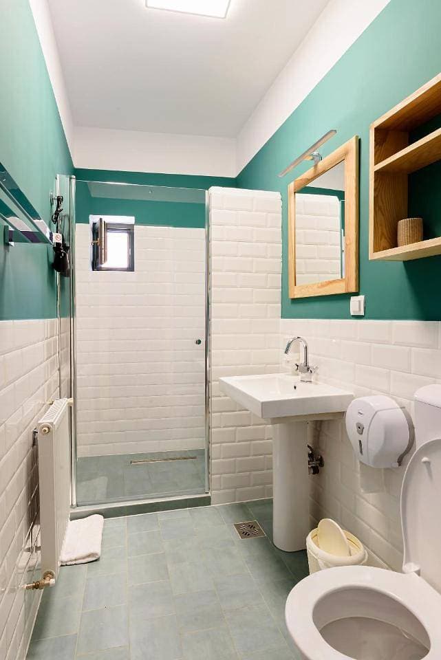 Foto 8 von 11: Triple Room with Private Bathroom
