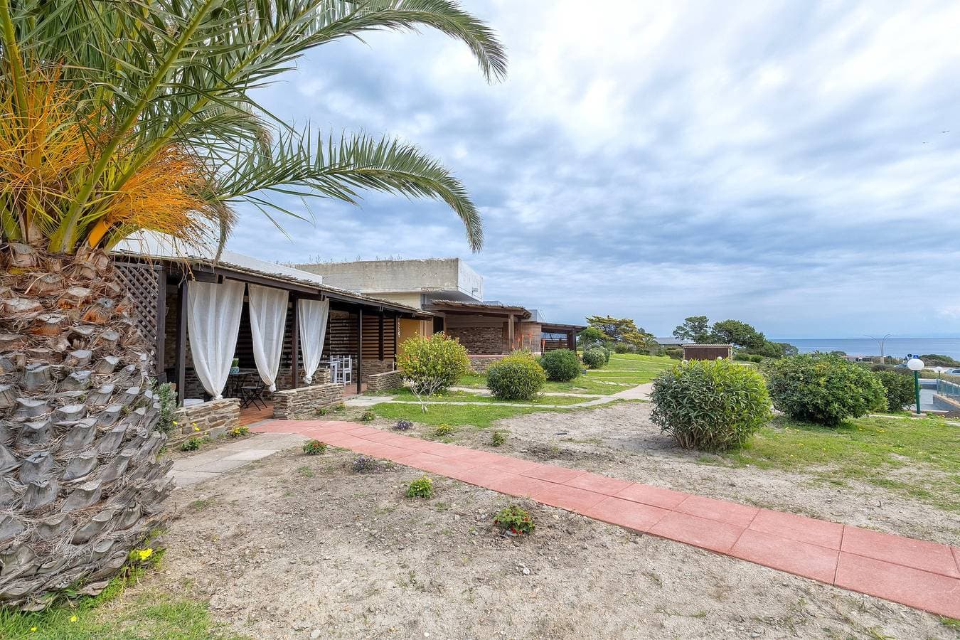 Foto 2 von 33: Ferienhaus 'Fiamma' mit Meerblick, privater Terrasse und Klimaanlage