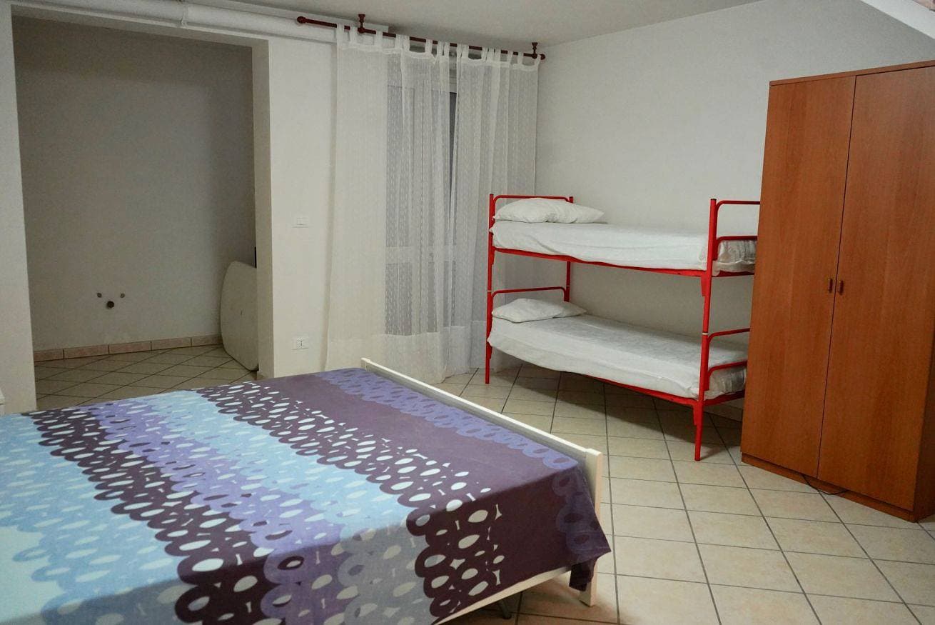 Foto 12 von 34: Ferienwohnung für 8 Personen mit Garten