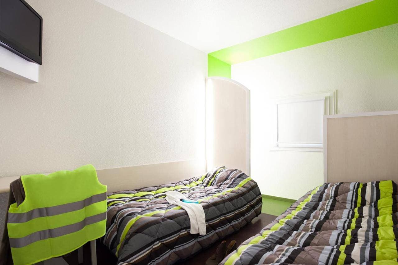 Foto 8 von 13: Twin Room with Shared Bathroom