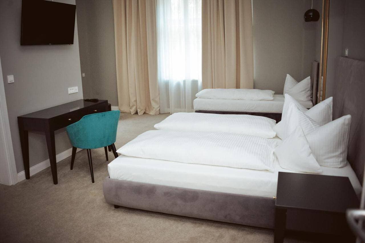 Foto 7 von 9: Triple Room