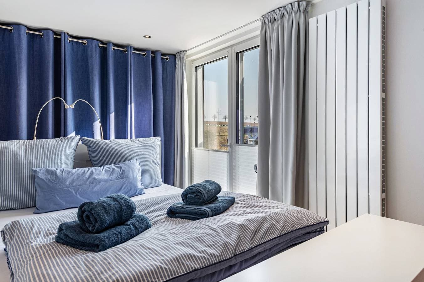 Foto 4 von 35: 'Ferienhaus Am See mit Boot', privater Terrasse, WLAN und Klimaanlage