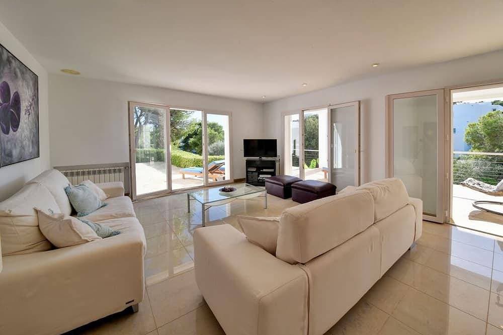 Foto 11 von 30: Villa mit direktem Strandzugang zu einer sandigen Bucht in Cala D'or Zentrum