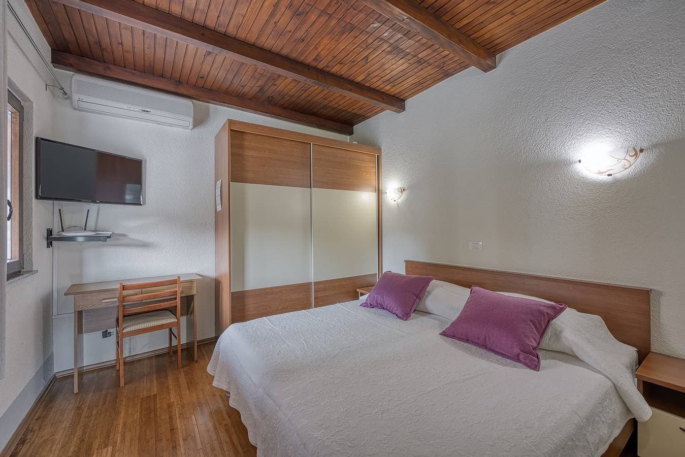 Foto 7 von 12: Ein Schlafzimmer - Haus Folo K1 - Rovinj