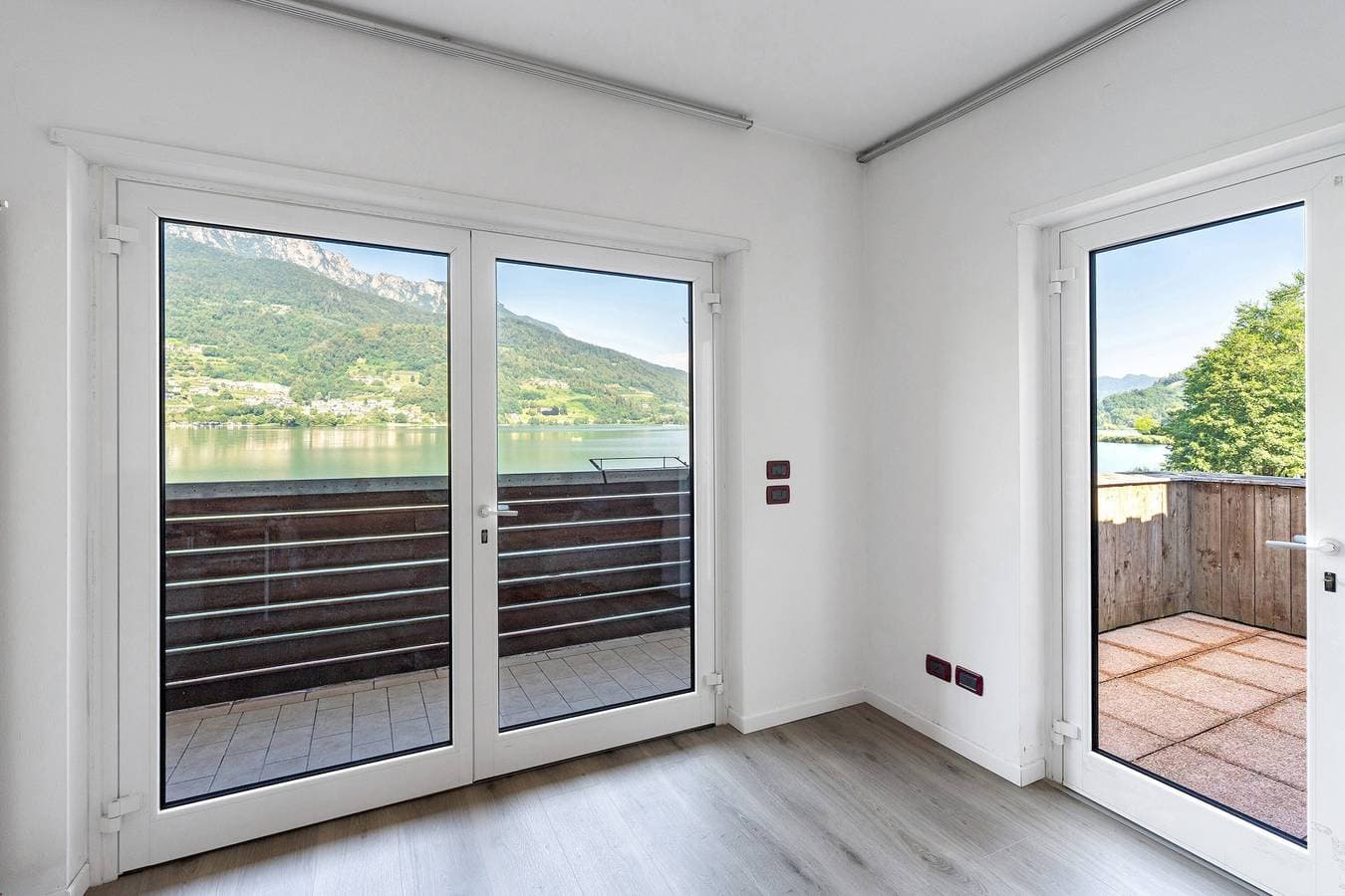 Foto 13 von 27: Apartment 'Valsugana D’incanto' mit Seeblick, privater Terrasse und Gemeinschaftsgarten