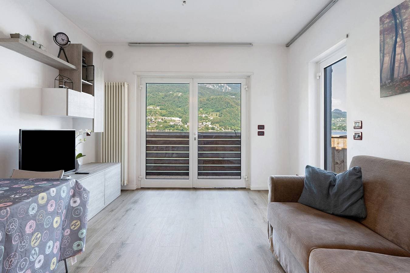 Foto 2 von 27: Apartment 'Valsugana D’incanto' mit Seeblick, privater Terrasse und Gemeinschaftsgarten