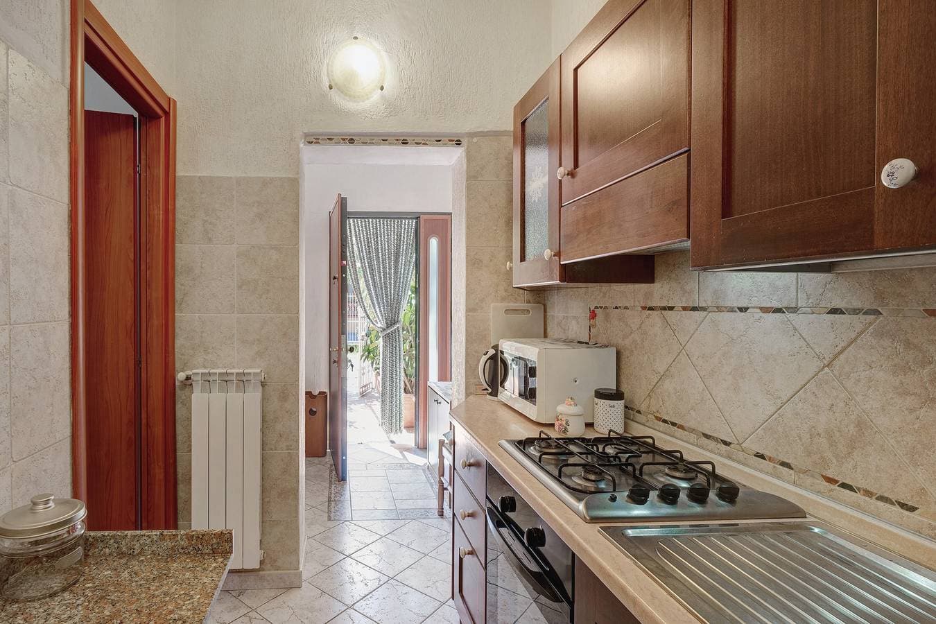 Foto 12 von 22: Apartment 'Casa Dei Garofani – Kostenfreier Parkplatz' mit privatem Garten