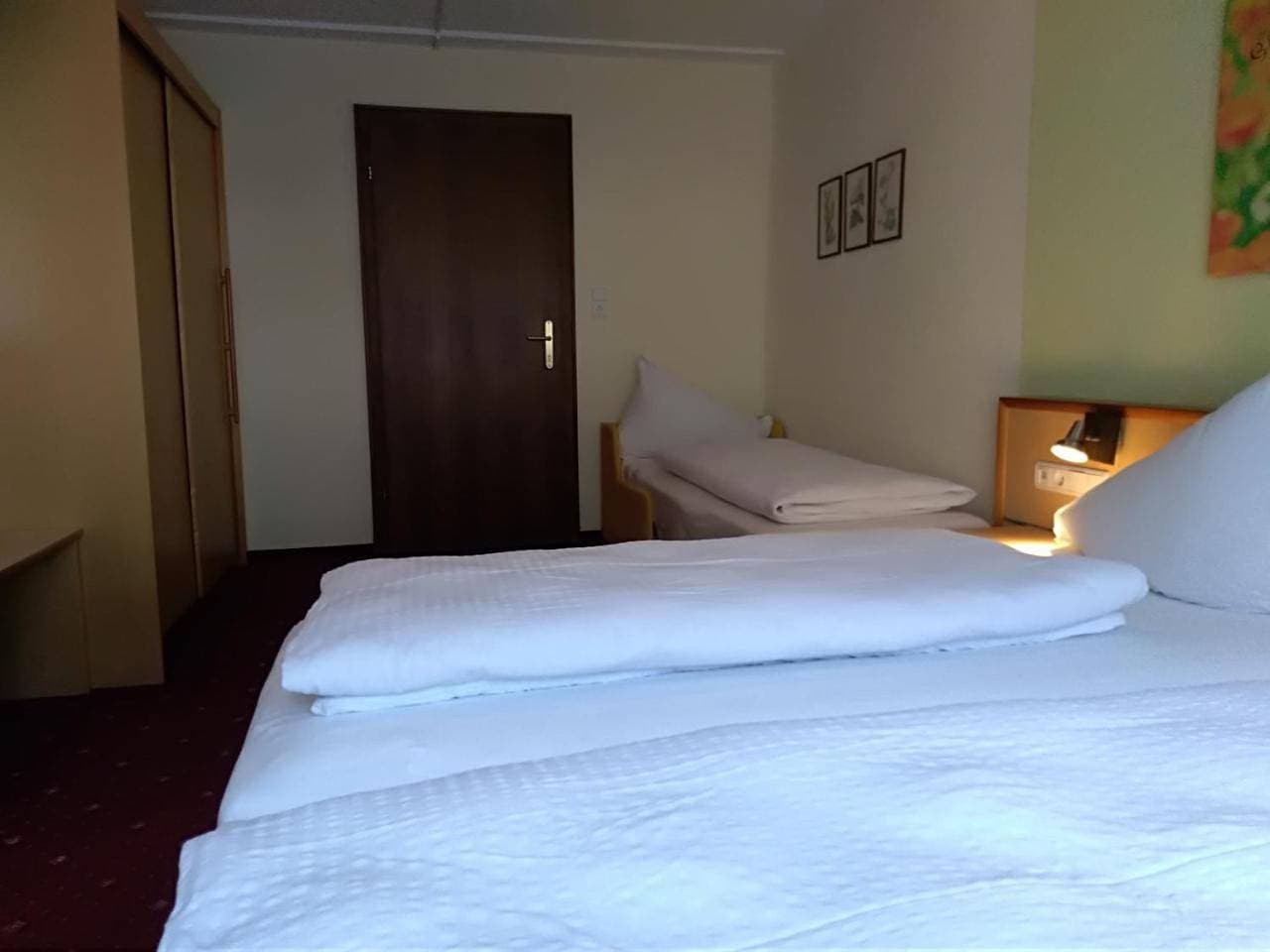 Foto 11 von 11: Triple Room with Balcony