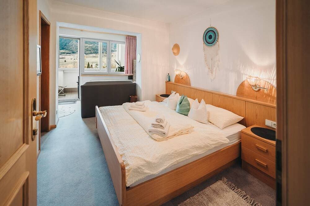 Foto 2 von 21: Zimmer „Garni Unterweggütl Karibik“ mit Bergblick, Gemeinschaftspool und WLAN