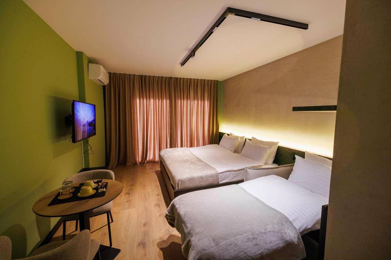 Foto 5 von 11: Double Room with Balcony (2 Adults + 1 Child)