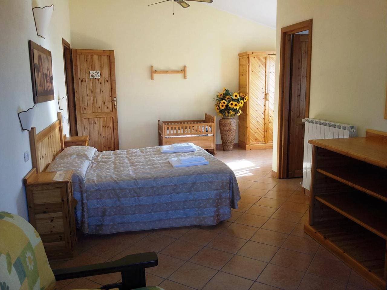 Foto 9 von 19: Quadruple Room with Garden View