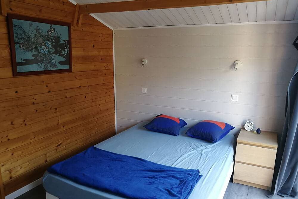 Foto 2 von 8: Two chalets (+40 m2) separated by a small patio 200m from the beach