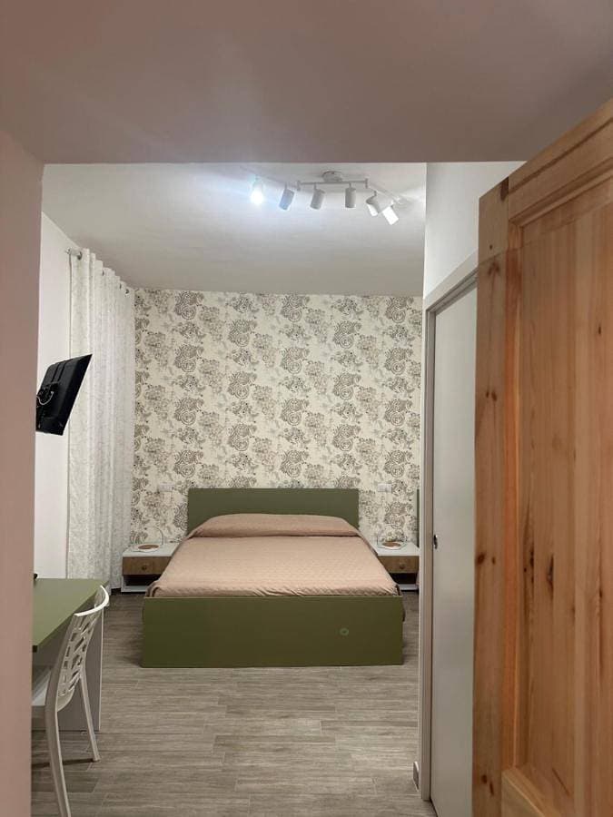 Foto 2 von 13: Triple Room with Private Bathroom