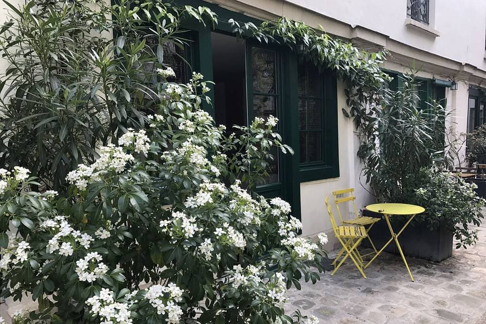 Wohnung Innenhof mit Bäumen, im Herzen von Paris 1