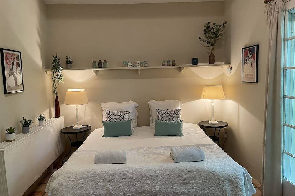 A beautiful romantic bedroom with a mezzanine area, bathroom and private garden 1