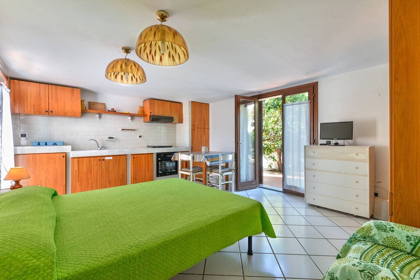 Foto 7 von 19: Einzimmerapartment 'Monolocale Nel Verde' mit Privatterrasse, Gemeinschaftsgarten und WLAN