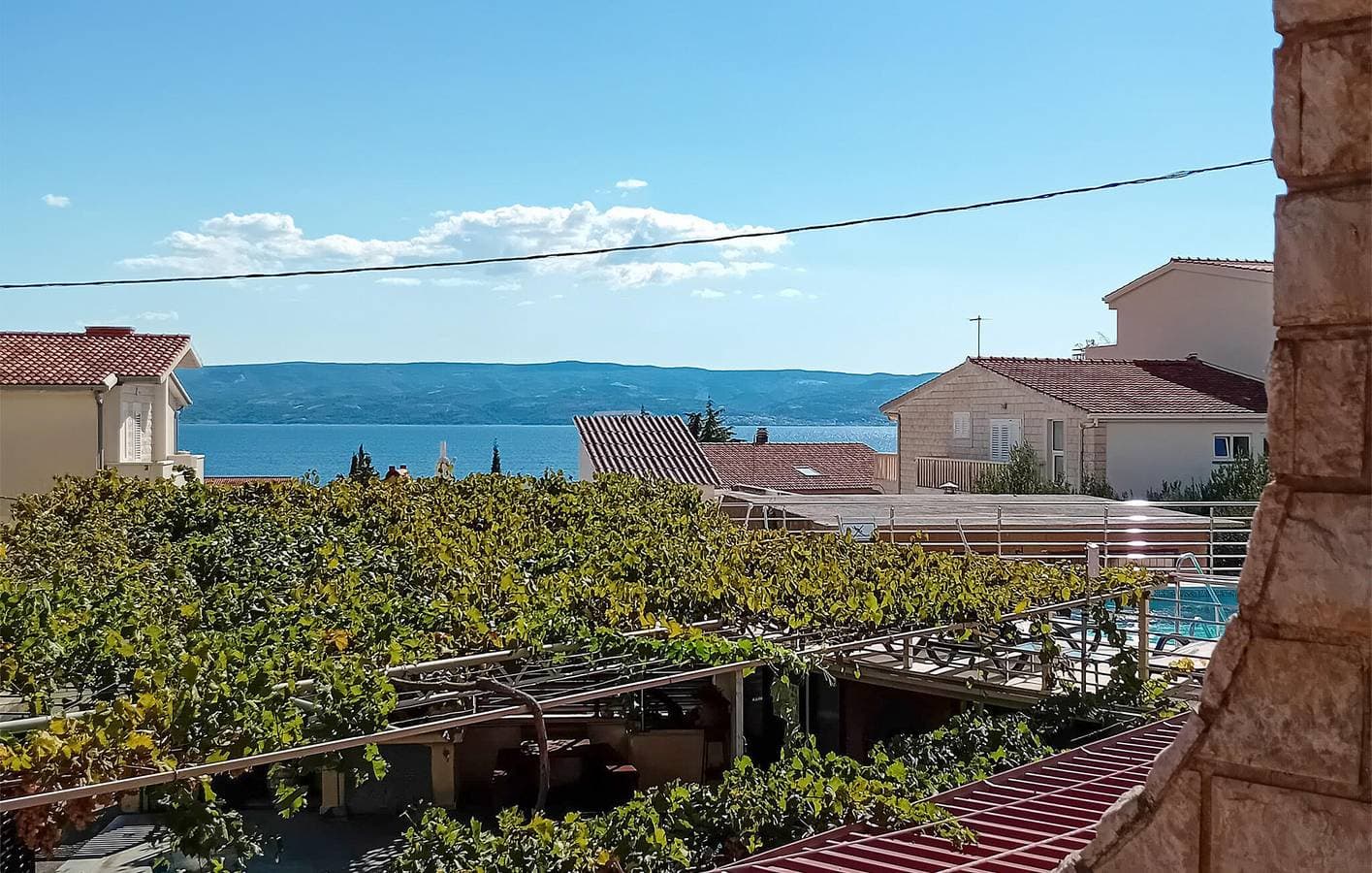 Foto 13 von 23: Apartment mit Meerblick, Wifi, AC, Pool und Terrasse
