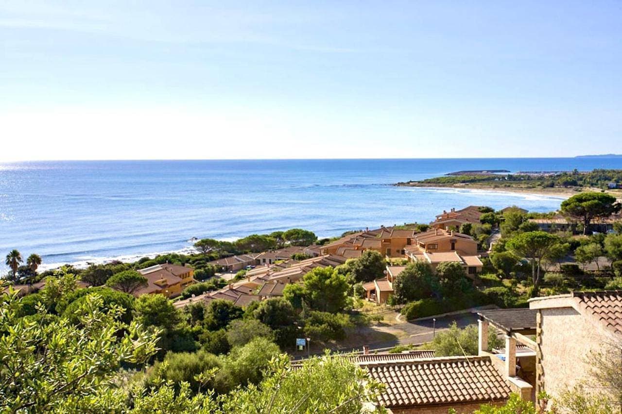 Village in Porto Corallo just 200 meters from the beach, apartments with private outdoor area 1