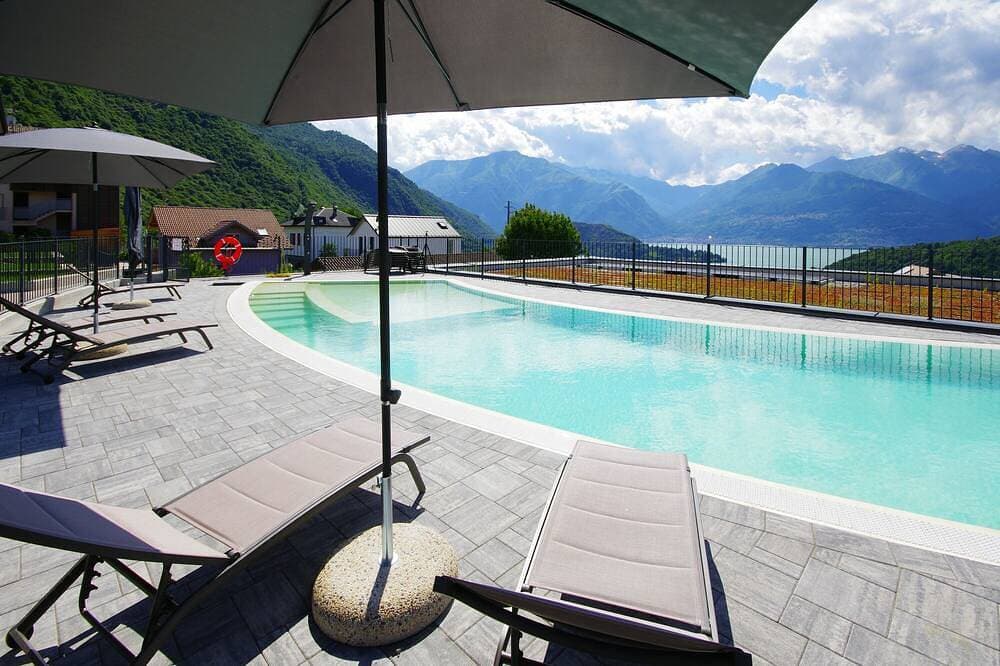 Modern lake view apartment with shared pool, garden, parking, air-conditioning 1