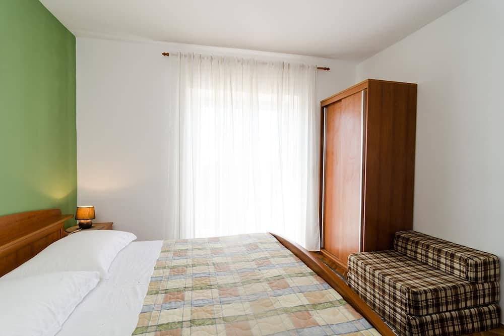 Foto 4 von 17: Guesthouse Moretic - Suite mit 2 Schlafzimmern, Balkon und Meerblick