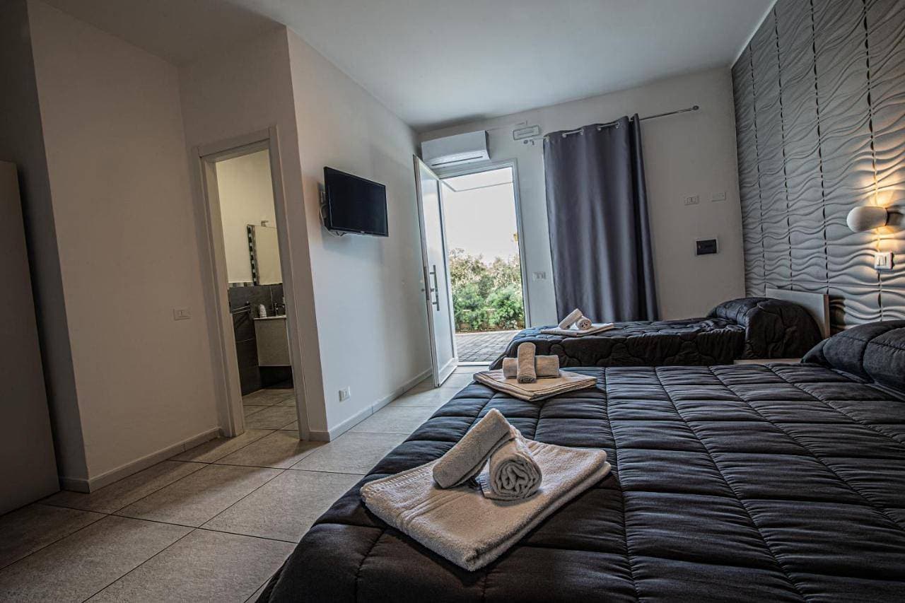 Foto 9 von 17: Triple Room with Garden View