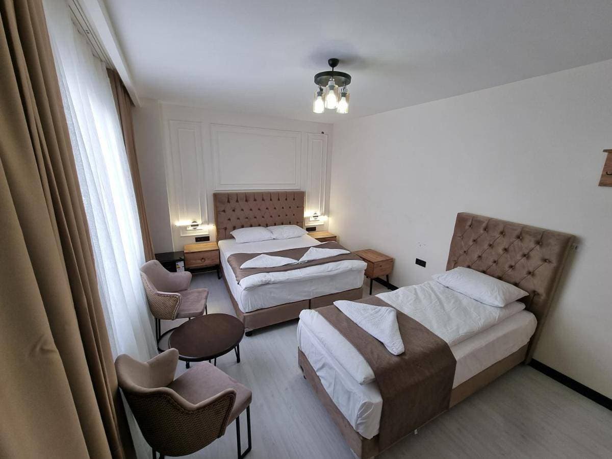 Foto 4 von 11: Deluxe Triple Room