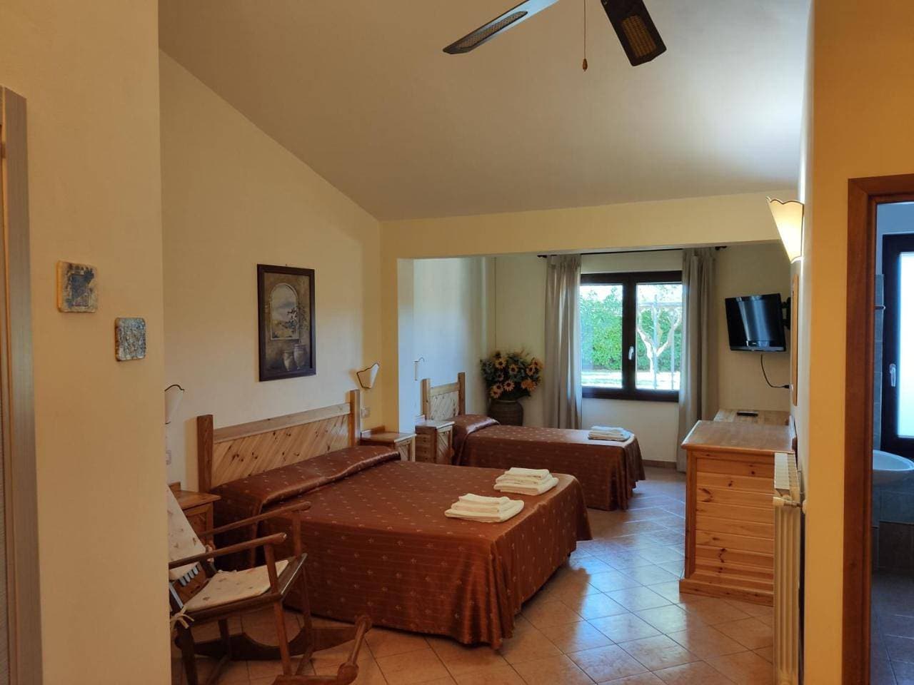 Foto 6 von 19: Quadruple Room with Garden View