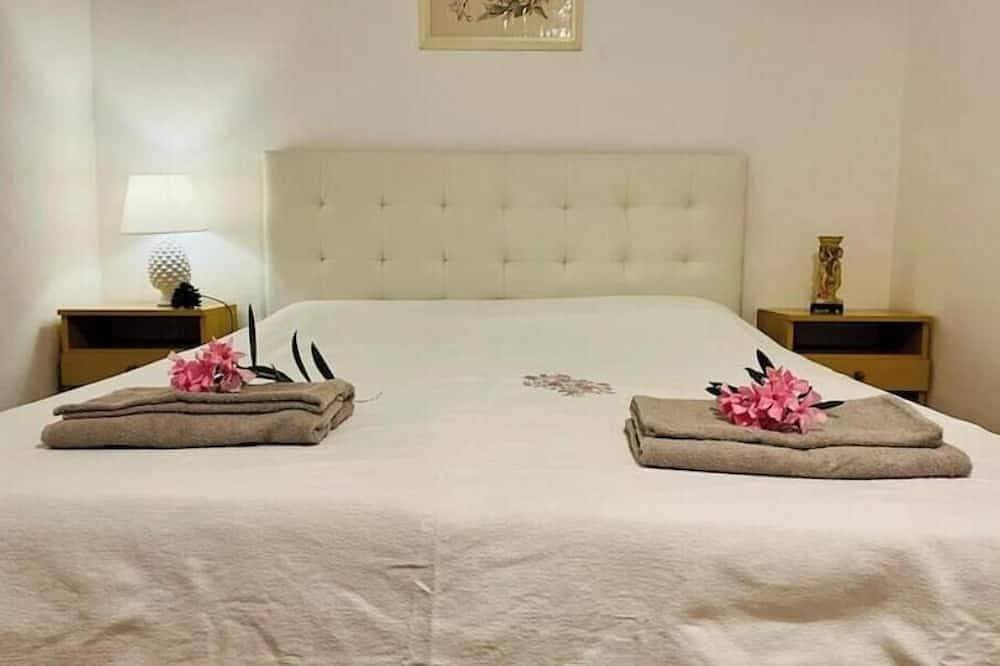Foto 3 von 30: Apartment in a villa under a large palm tree and garden