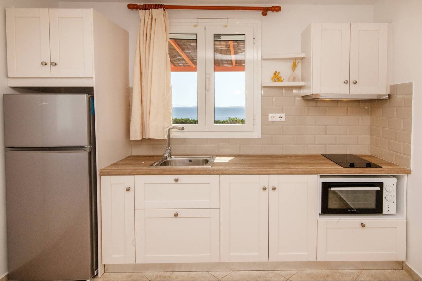 Foto 4 von 19: Ferienhaus 'Anemologio 201 Tinos' mit Meerblick, WLAN und Klimaanlage