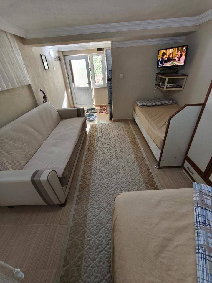 Foto 8 von 26: Quadruple Room with Garden View
