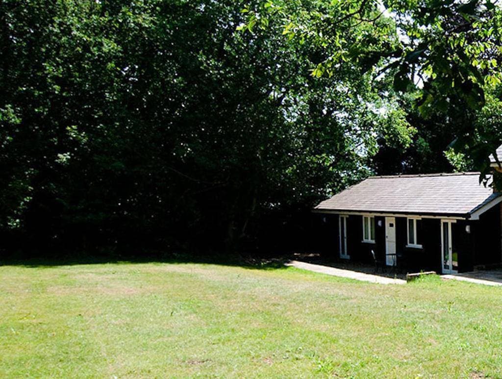 Cottage surrounded by woodland and vineyards. 1