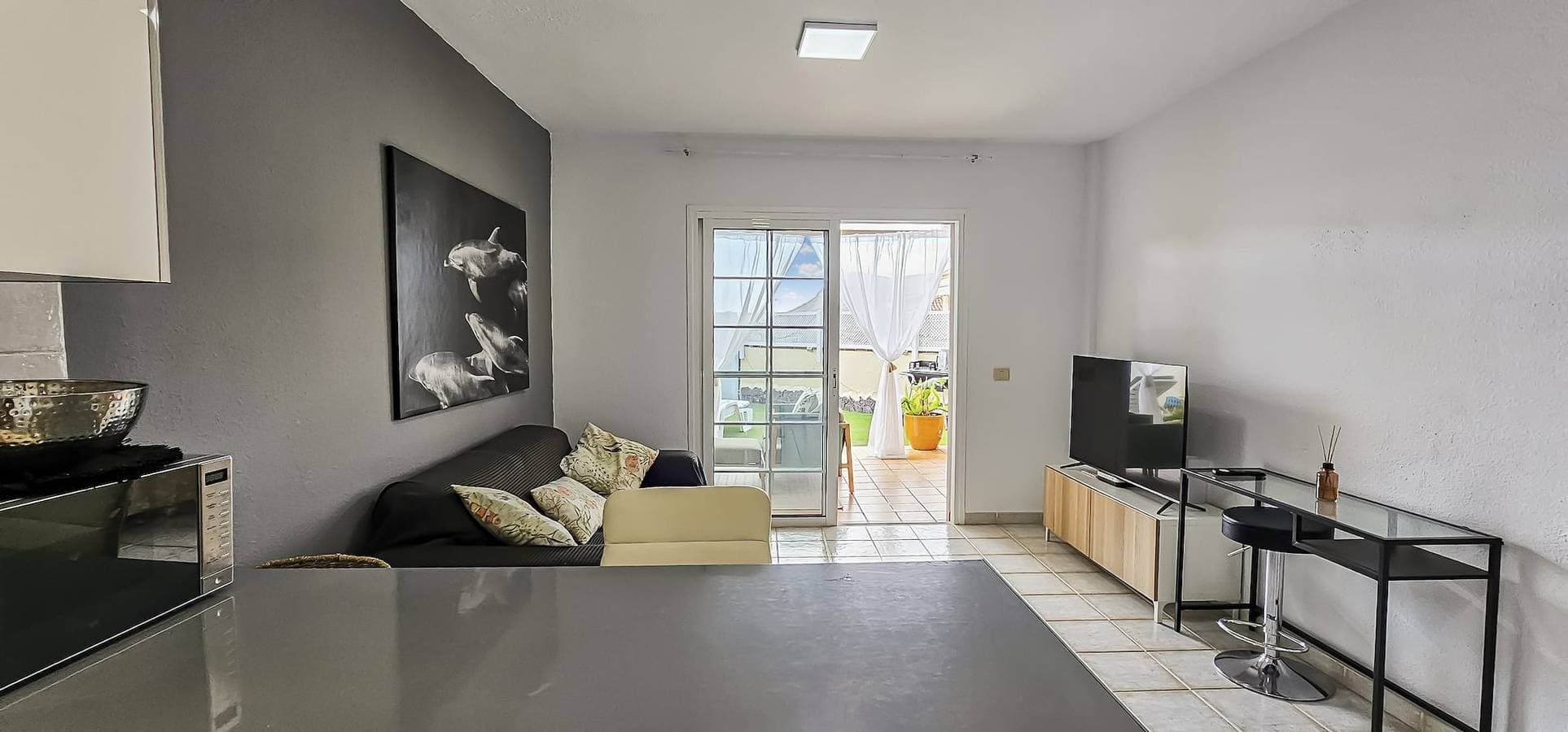 Foto 6 von 17: Sunny Garden 1 Br Apartment Arona