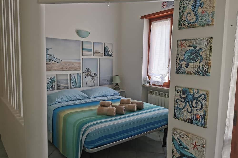 Ferienwohnung mit Terrasse, A/C, WiFi · 50 m zum Strand 1