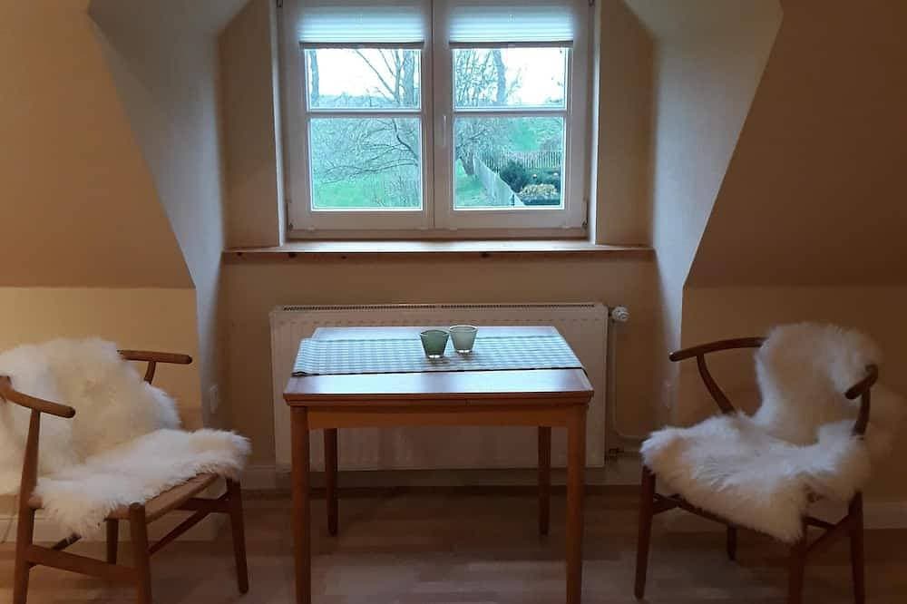 Foto 10 von 11: Cozy living under thatch