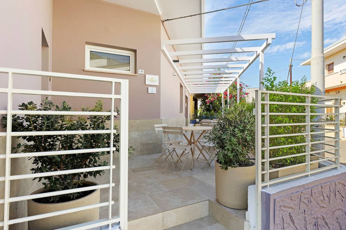 Foto 11 von 18: Bed & Breakfast 'L'Aurora – Zimmer Alba' mit Gemeinschaftsterrasse, WLAN und Klimaanlage