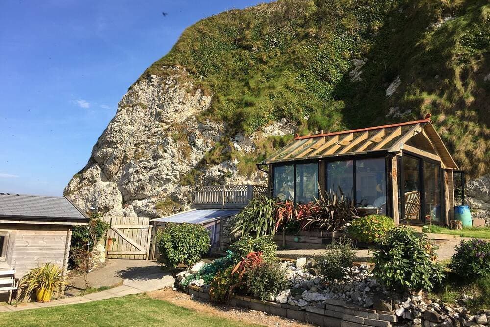 Foto 9 von 30: Schönes Ferienhaus direkt am Meer, weitläufige private Gärten, atemberaubender Meerblick.