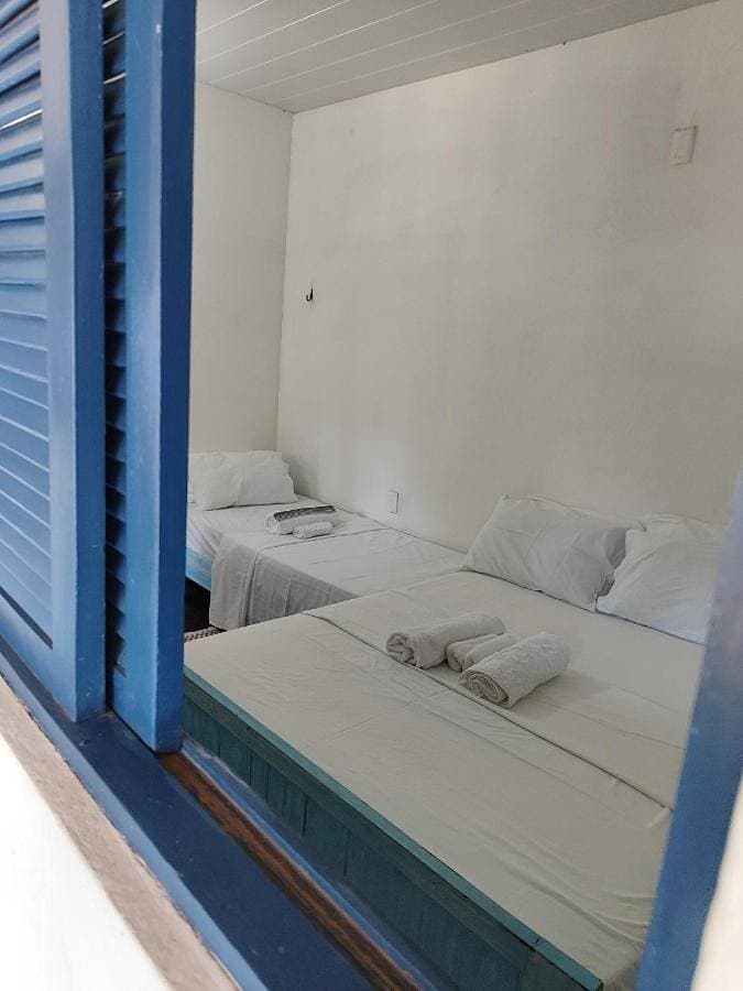 Foto 3 von 24: Economy Triple Room with Shared Bathroom