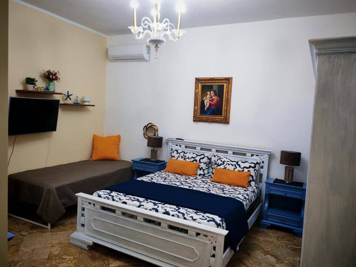 Foto 4 von 14: Triple Room with Shared Bathroom