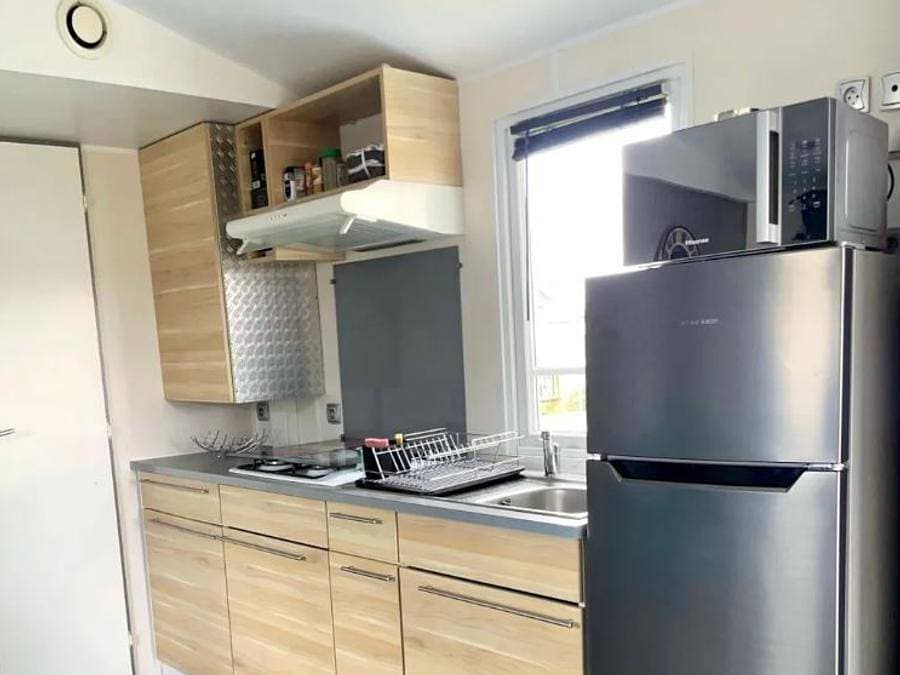 Foto 8 von 25: Camping Le Clos Savoye - Mobilheim 4 personen - 2 Schlafzimmer - TV