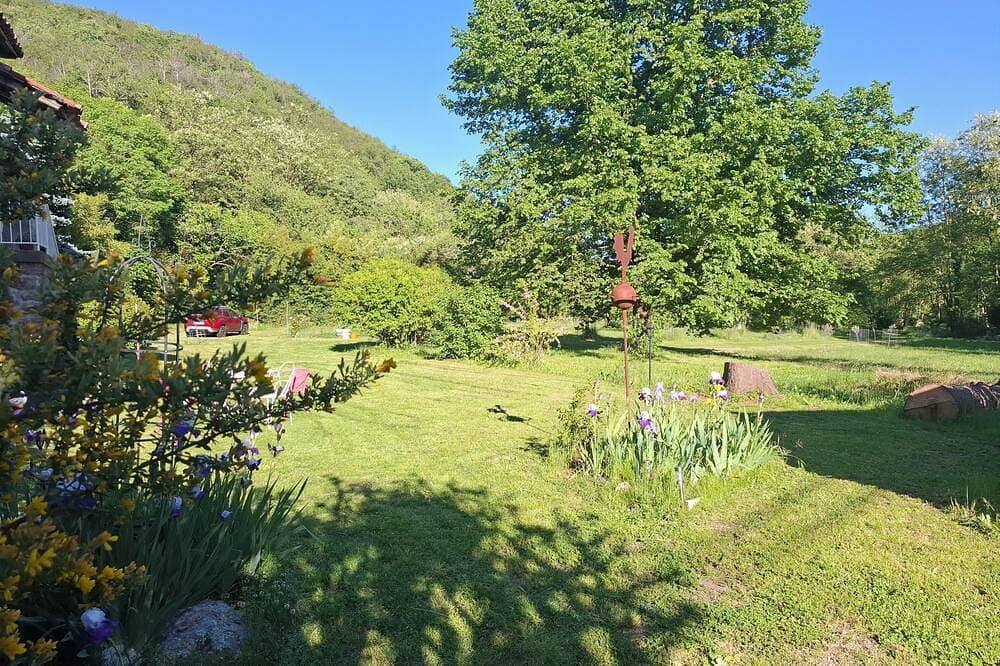 Foto 11 von 30: Maison de Famille Dans Parc de Verdure