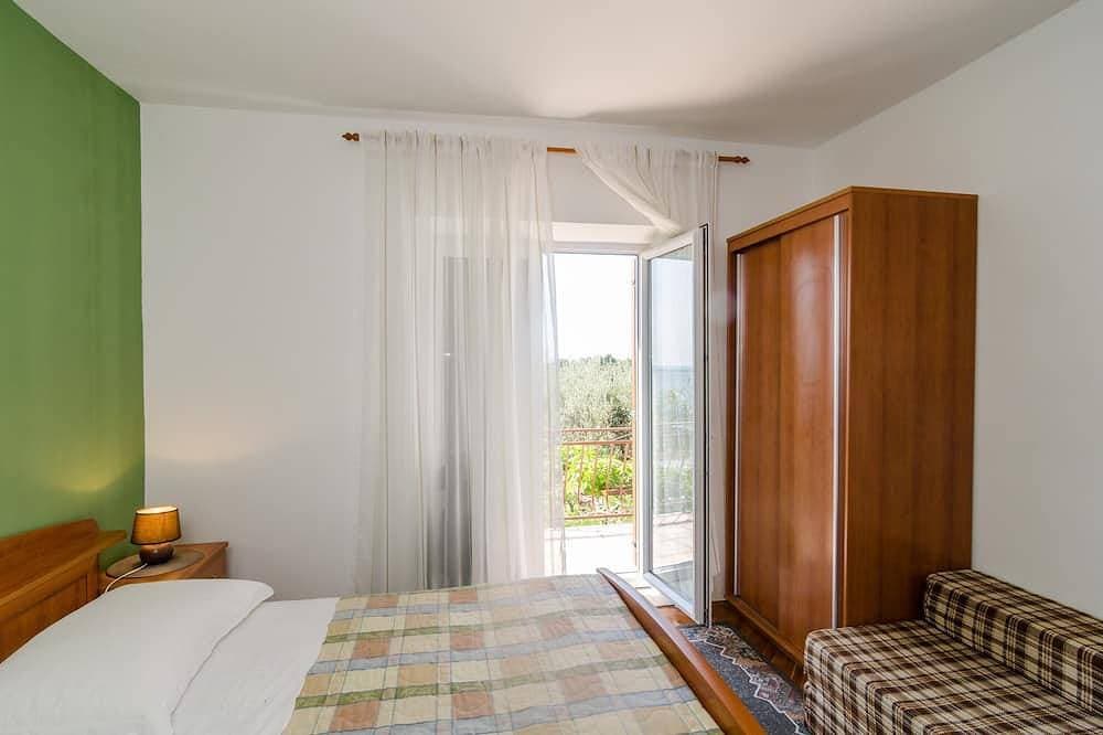 Foto 3 von 17: Guesthouse Moretic - Suite mit 2 Schlafzimmern, Balkon und Meerblick