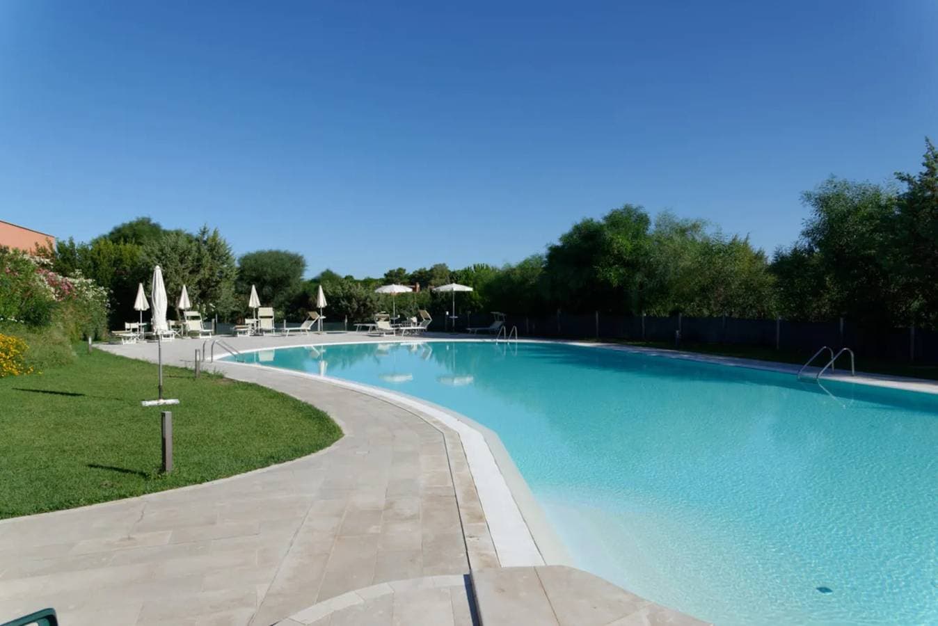 Foto 2 von 26: Ferienhaus "Antonella Sul Golf" mit Gemeinschaftspool, privater Terrasse und WLAN