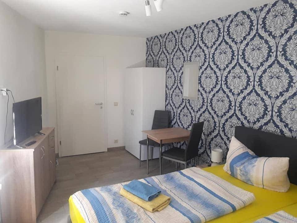 Foto 7 von 8: Triple Room with Bathroom