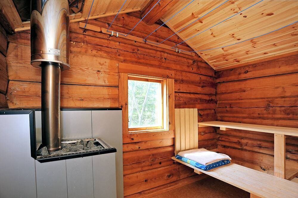 Foto 10 von 22: Ferienhaus Tived - direkt am See, Sauna, Boot, Badezuber