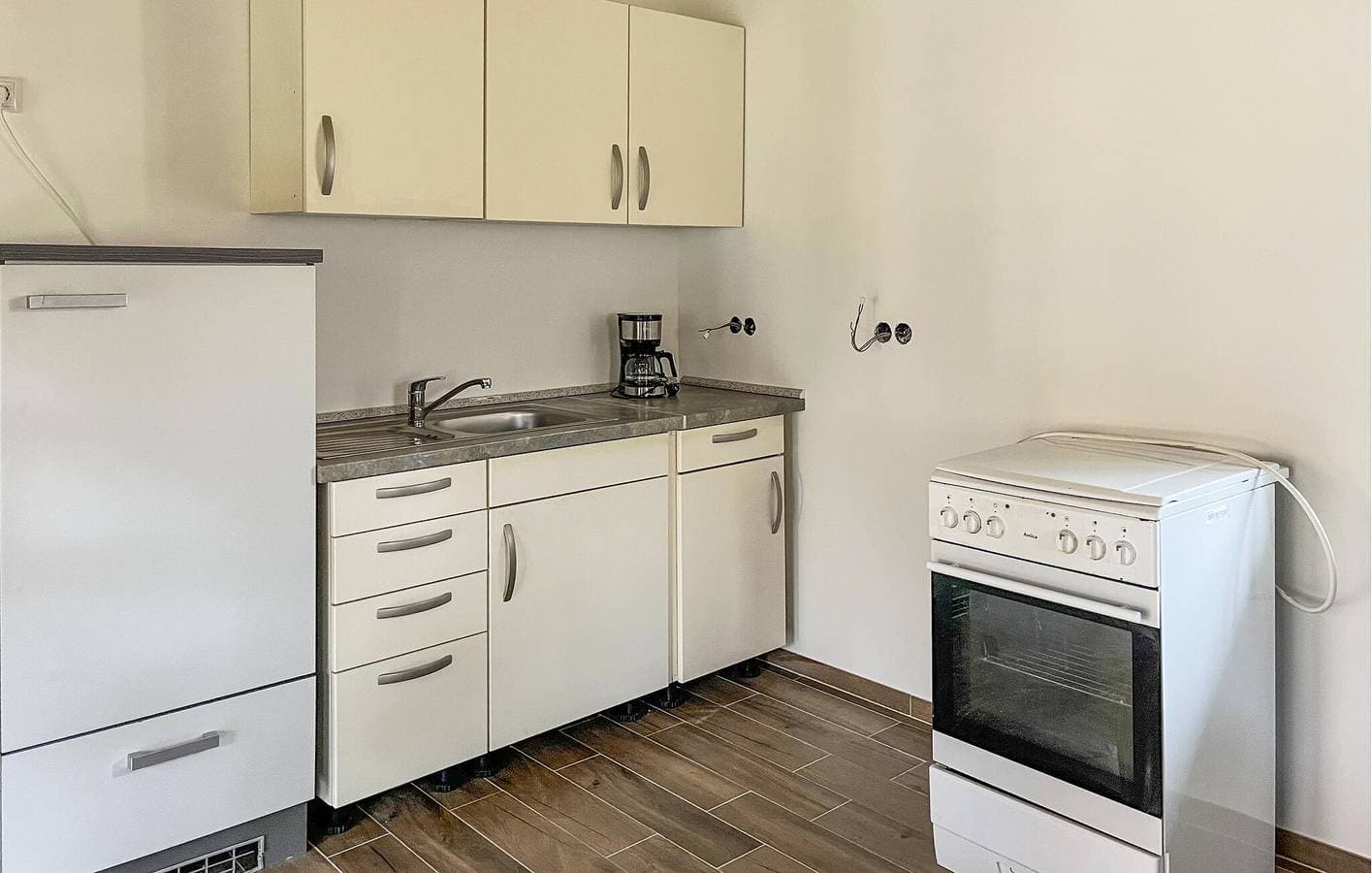Foto 11 von 13: Modernes Apartment mit Terrasse, Küche, WLAN und Fernseher